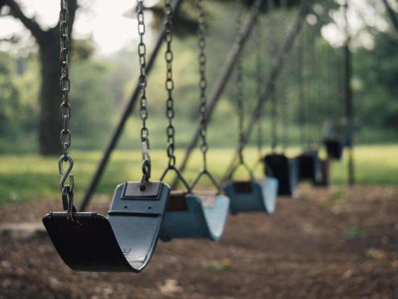 Empty Swings in Park — Green