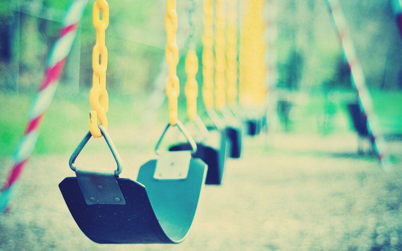 Empty Swings in Playground