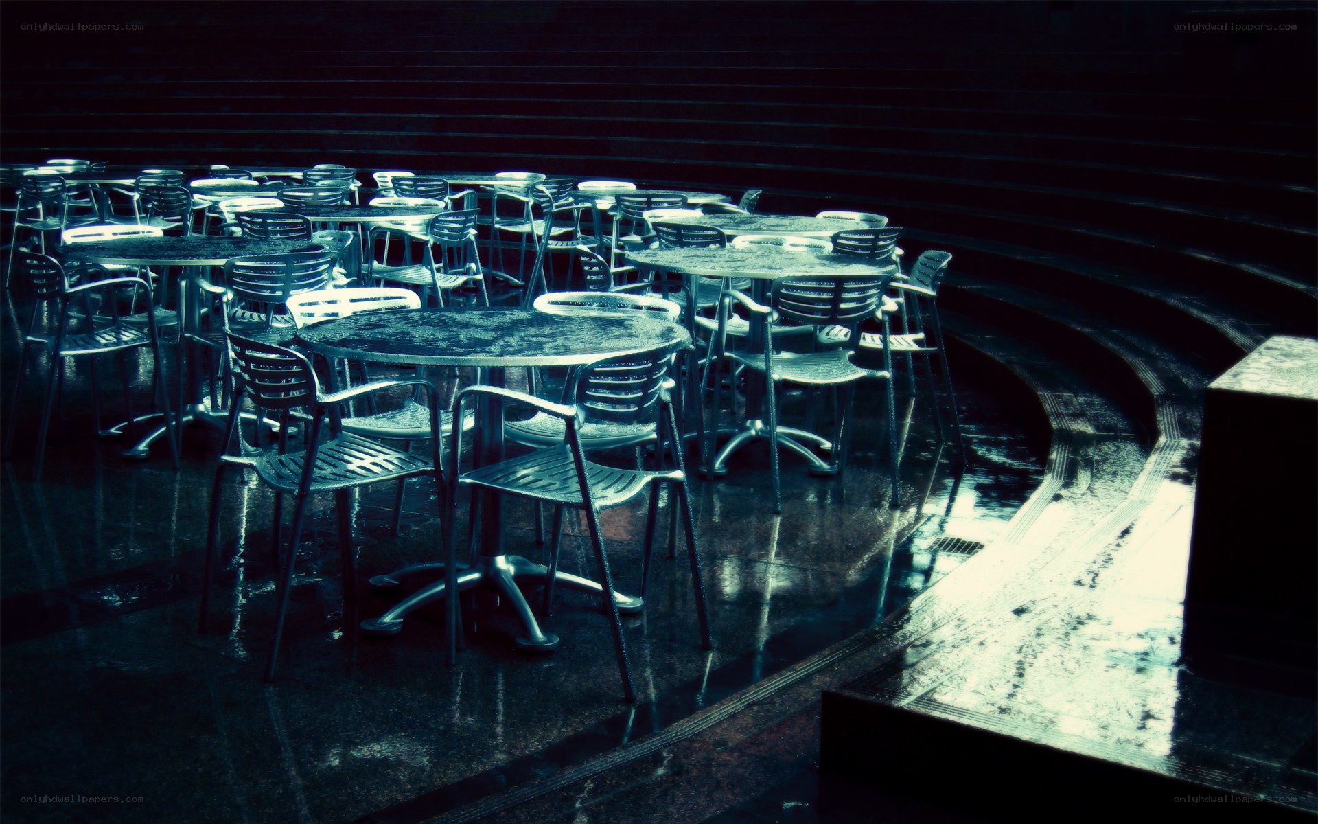 Empty tables in a dark hall