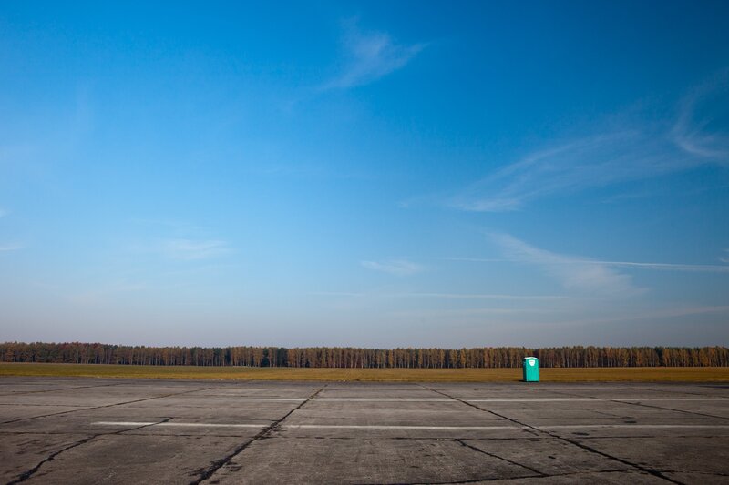 Empty tarmac with portable toilet
