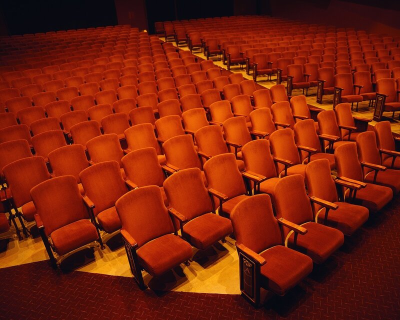 Empty theater seats in warm light