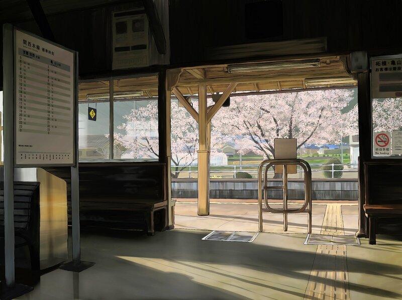Empty train station with cherry blossoms