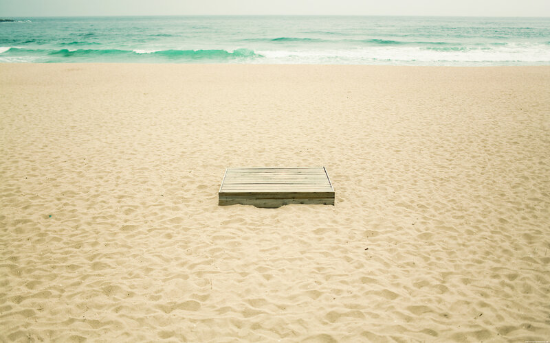 Empty wooden box on beach