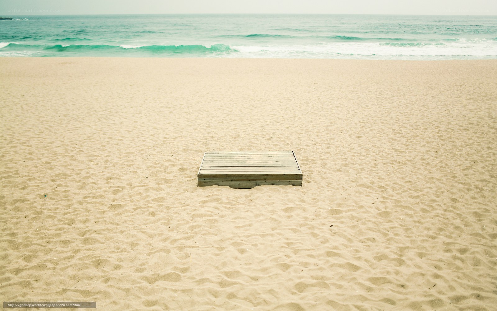 Empty wooden box on beach