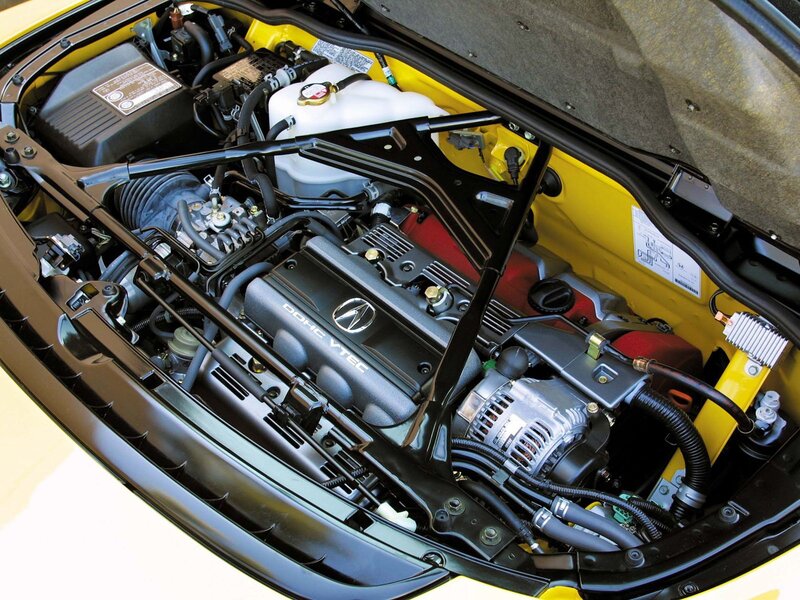 engine bay of a yellow car