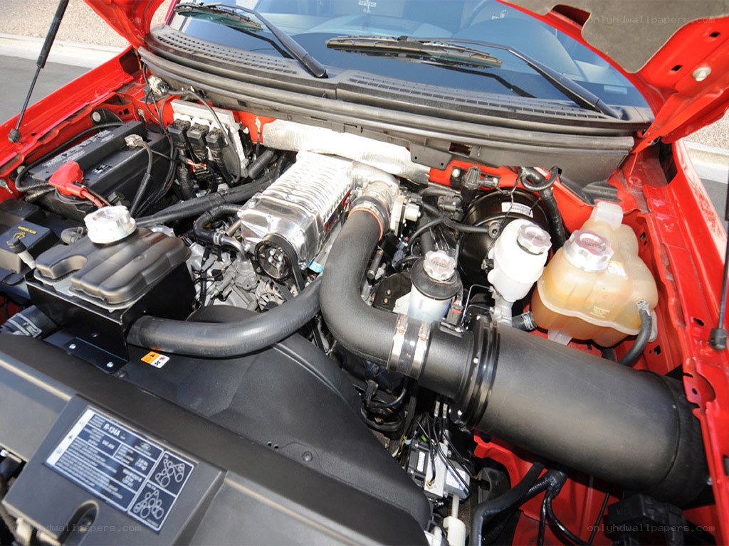 engine bay of red car
