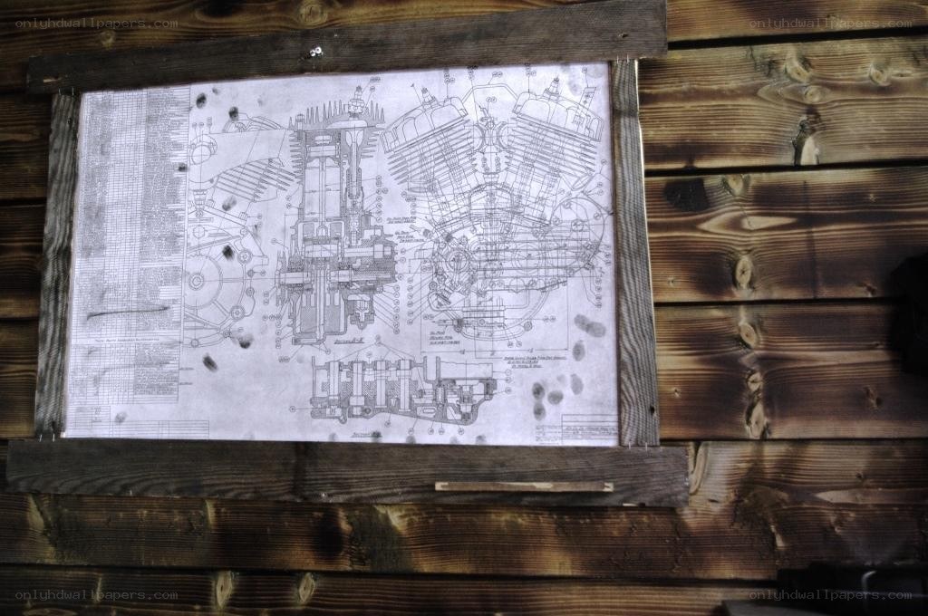 engine blueprint on wooden wall