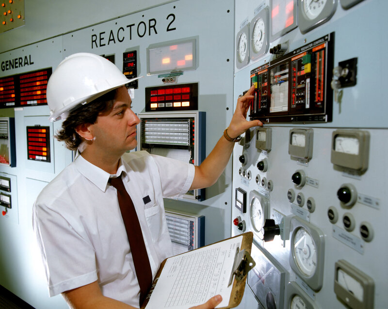 Engineer at reactor control panel