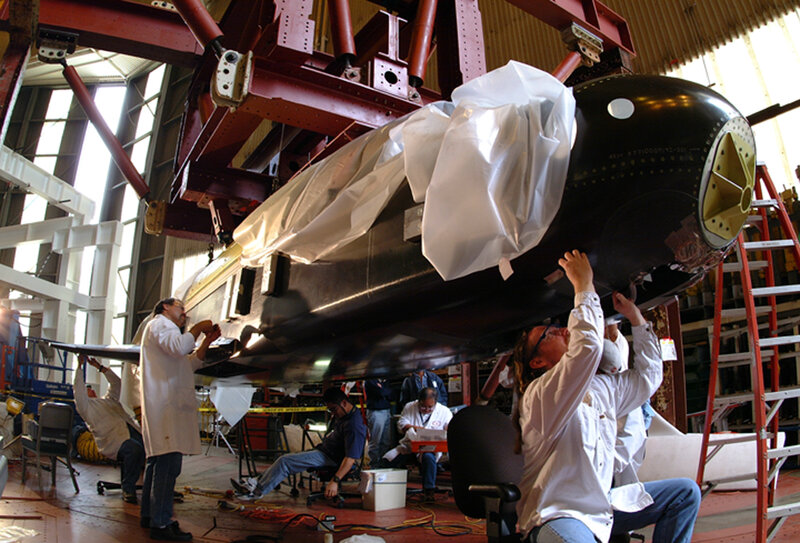 Engineers working on a missile