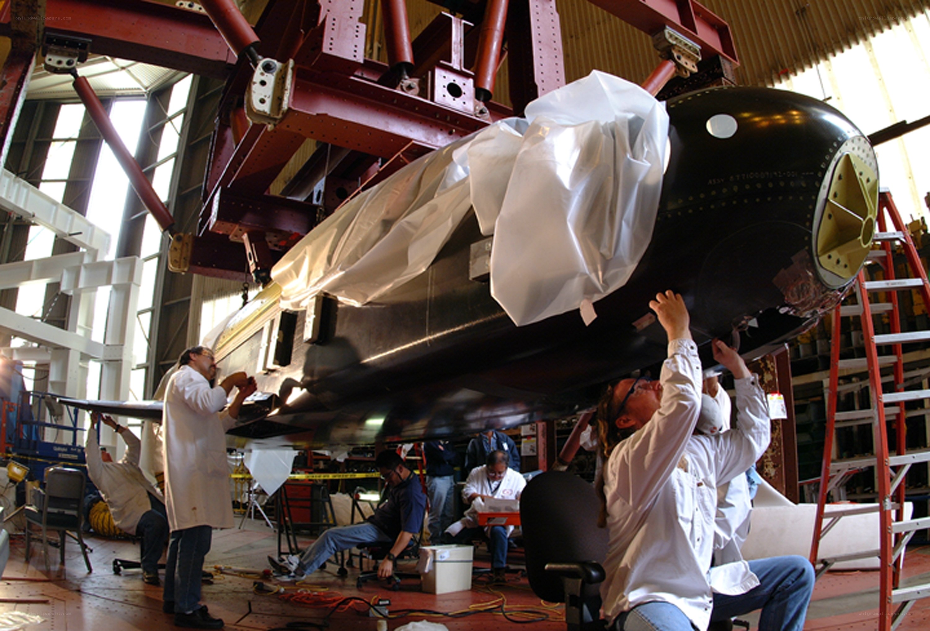 Engineers working on a missile