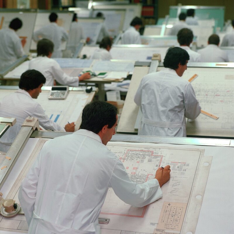 Engineers working on blueprints