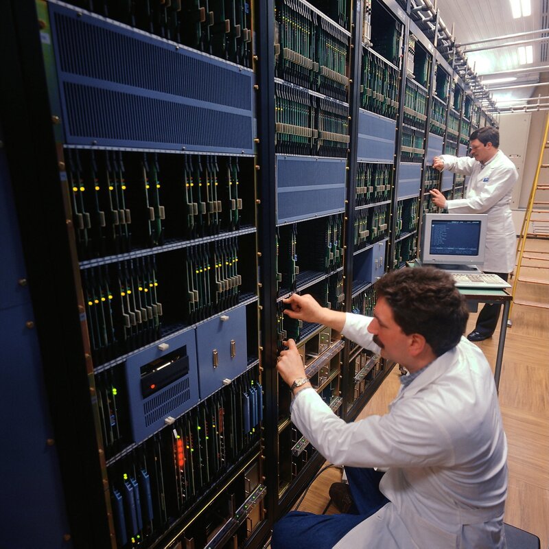 Engineers working on server racks