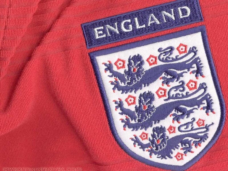 England football crest on red jersey