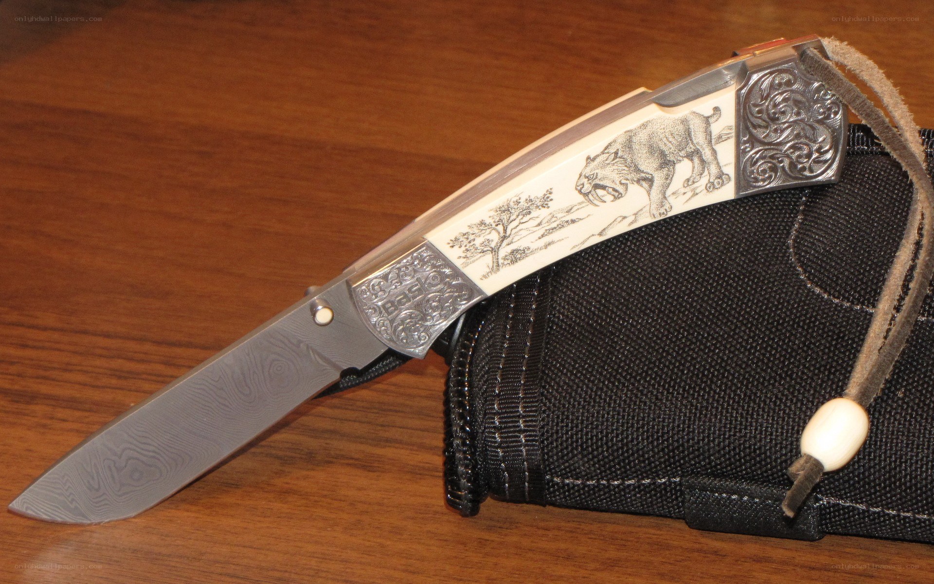 Engraved folding knife
