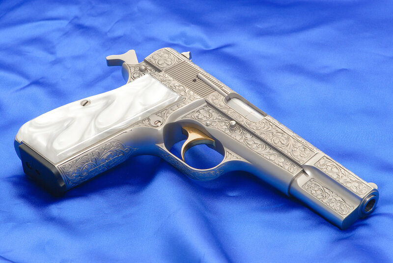 Engraved Pistol with White Grips