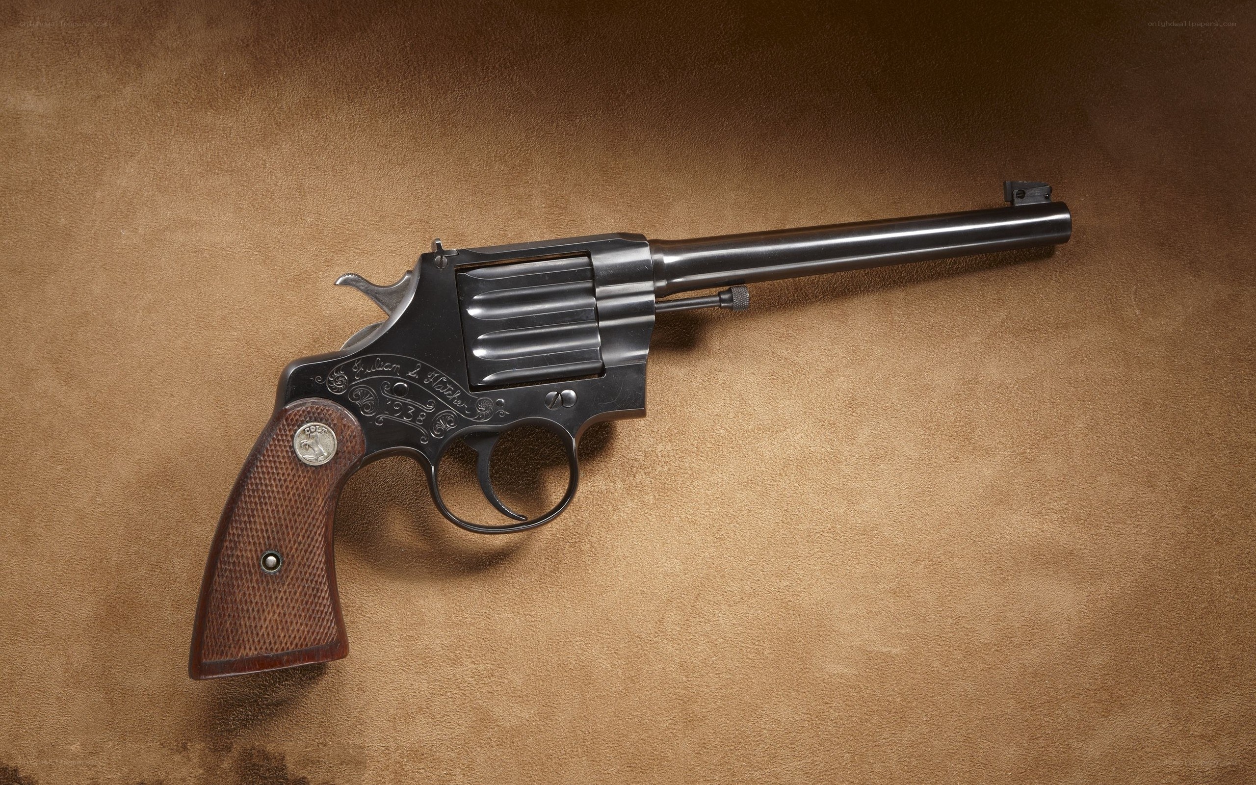 Engraved revolver on leather