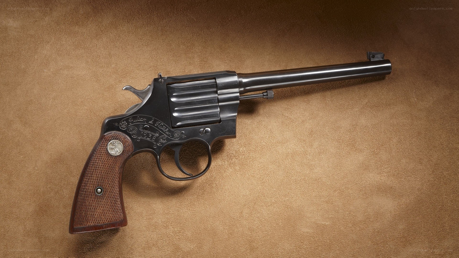 engraved revolver on leather