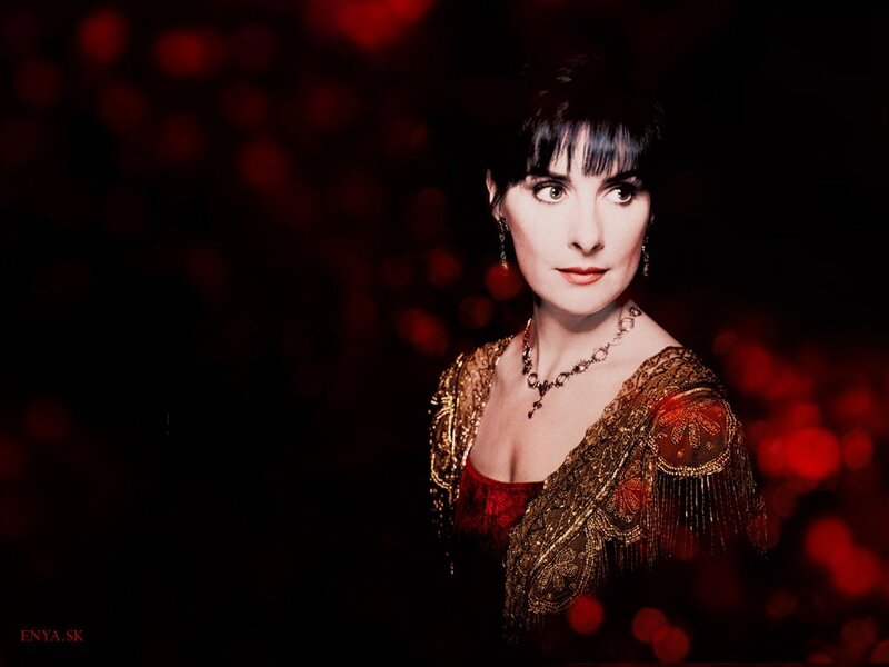 Enya in a red and gold outfit