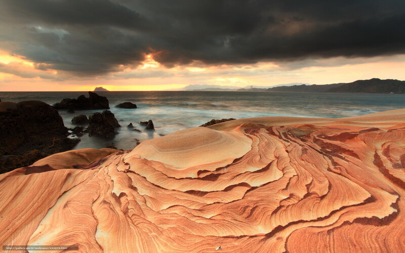 Eroded rock formations at sunset