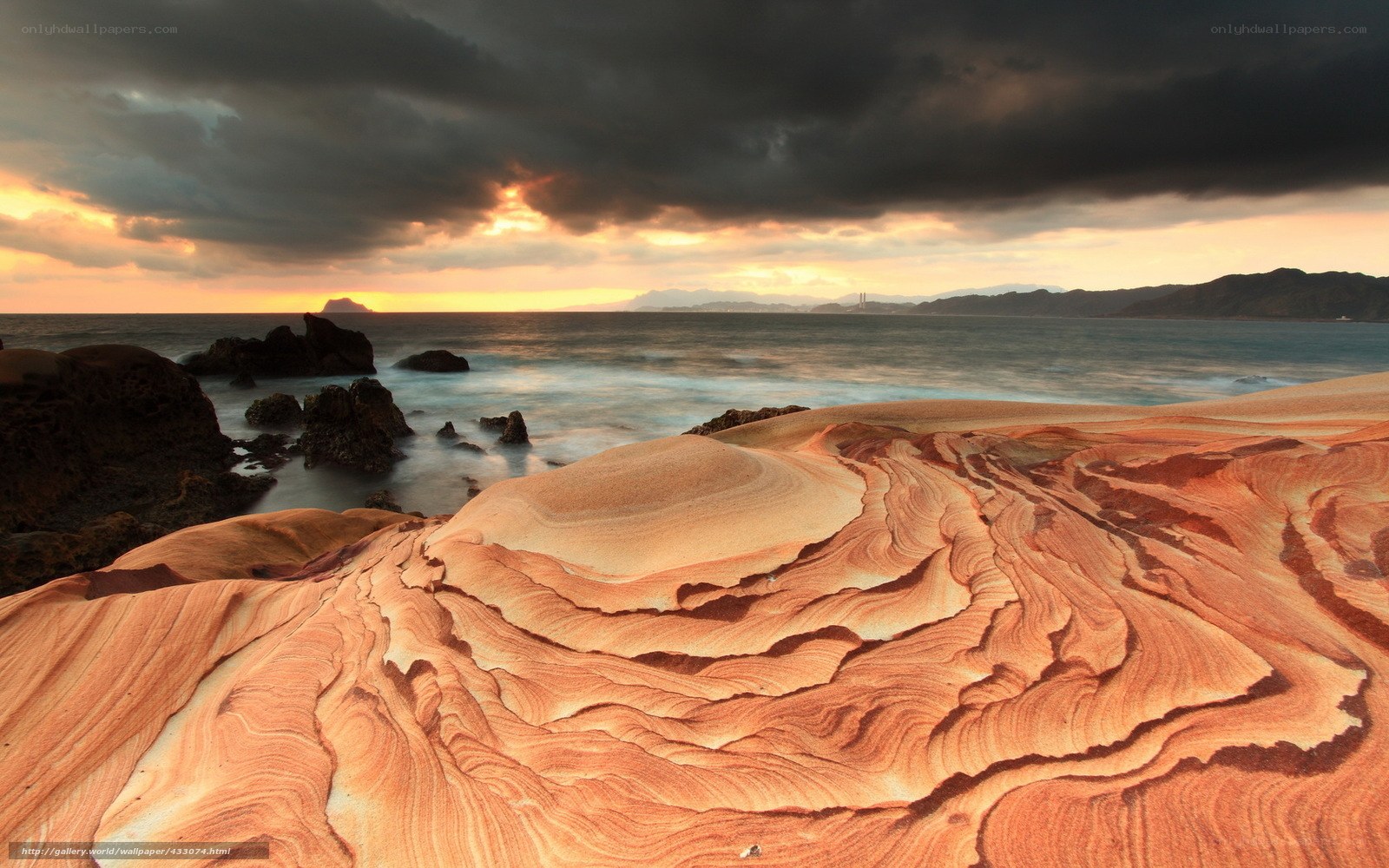 Eroded rock formations at sunset