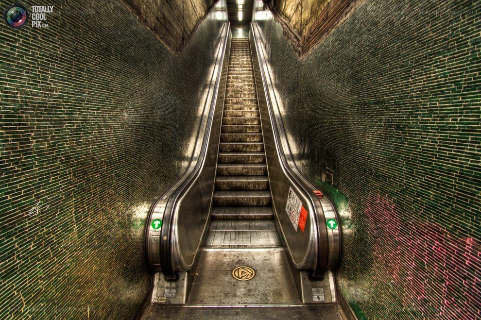 Escalator in a tiled tunnel