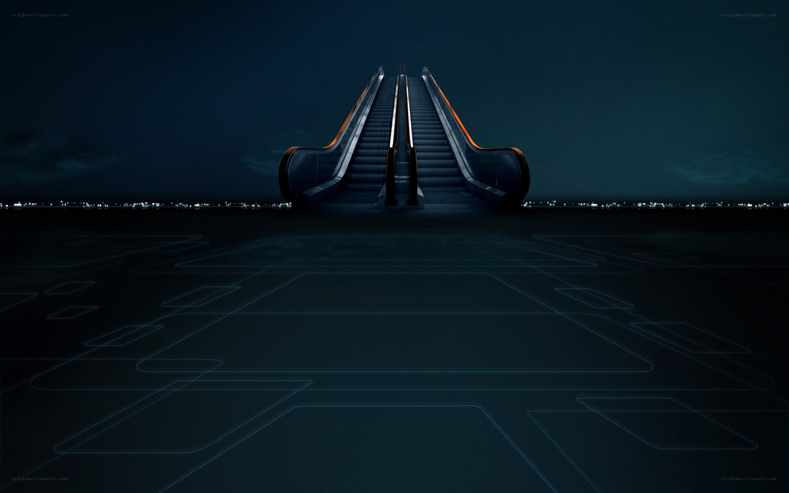 Escalators at night with city lights
