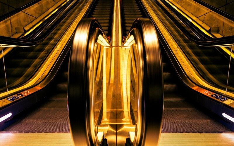 Escalators in Subway Station — Yellow, Dramatic, Night, Photograph, Escalator, Handrail