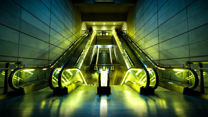 Escalators in Subway Station — Yellow, Dramatic, Night, Photograph, Stairs