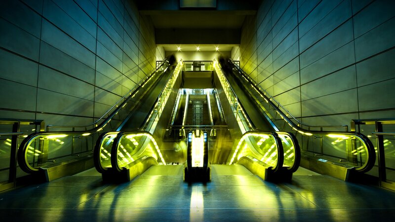 Escalators in Subway Station — Yellow, Dramatic