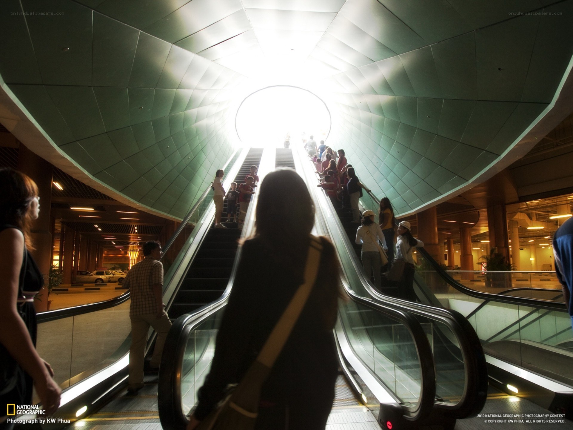 Escalators leading to light