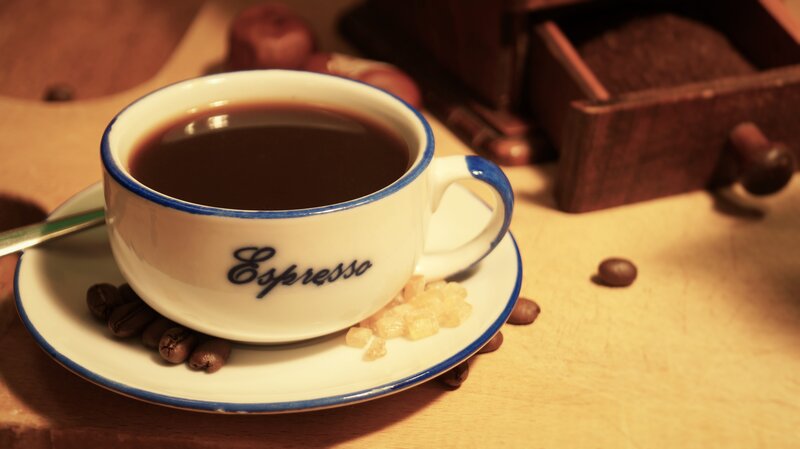 Espresso cup with coffee beans