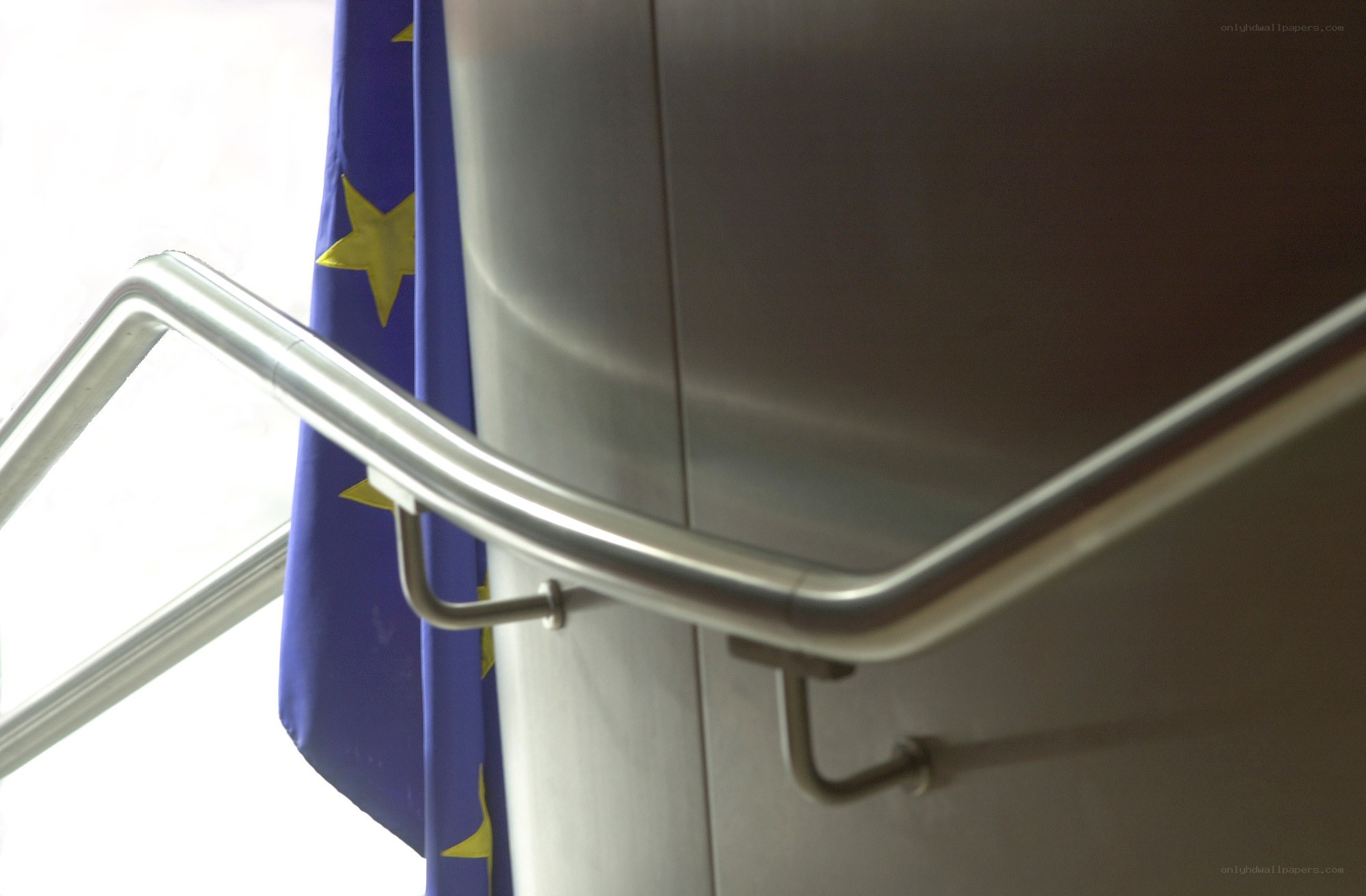 EU flag near metal railing