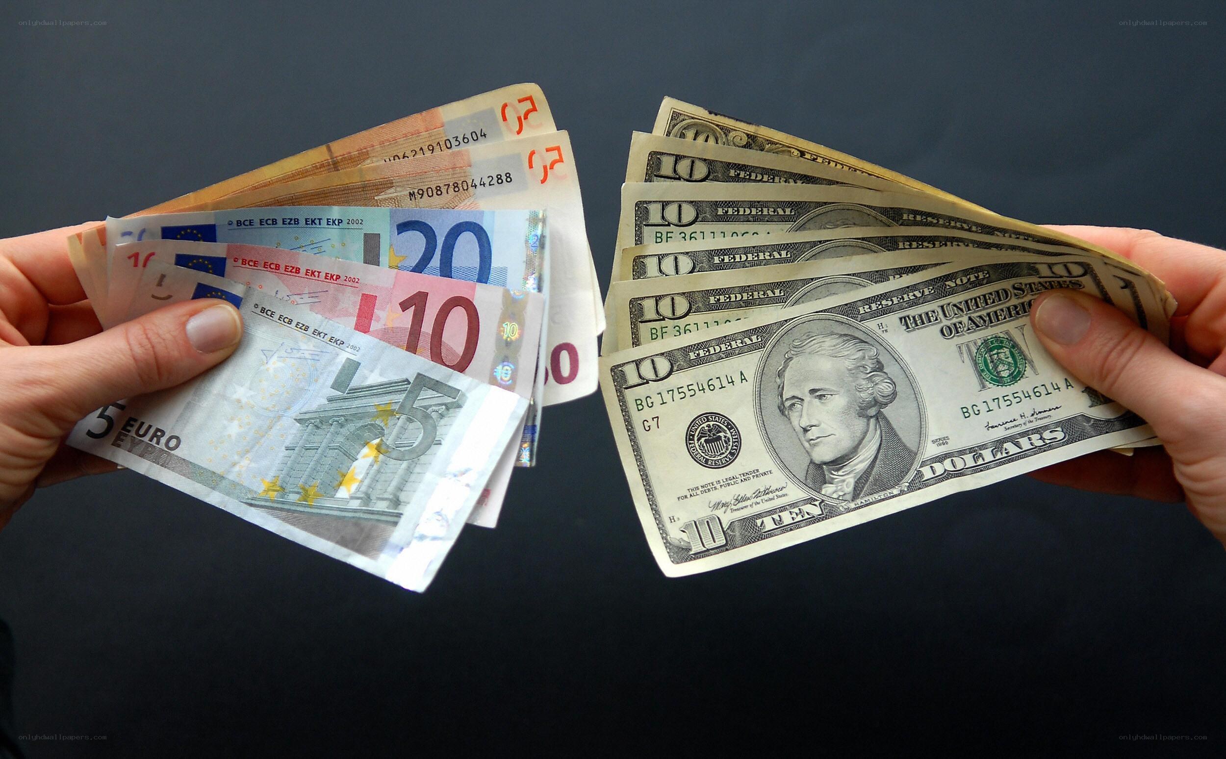 Euro and dollar bills comparison