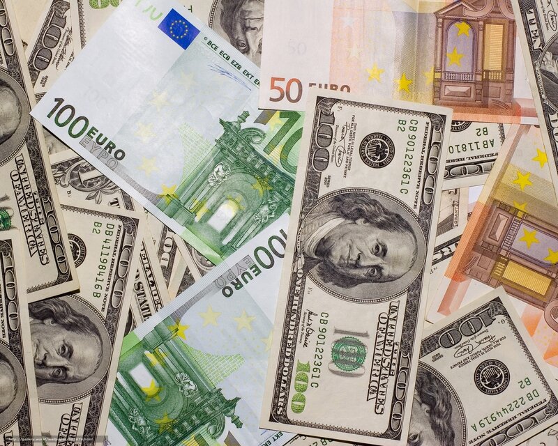 Euro and Dollar Bills — Green