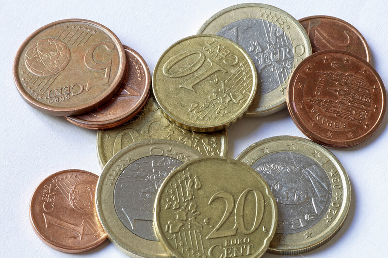 Euro coins on white surface