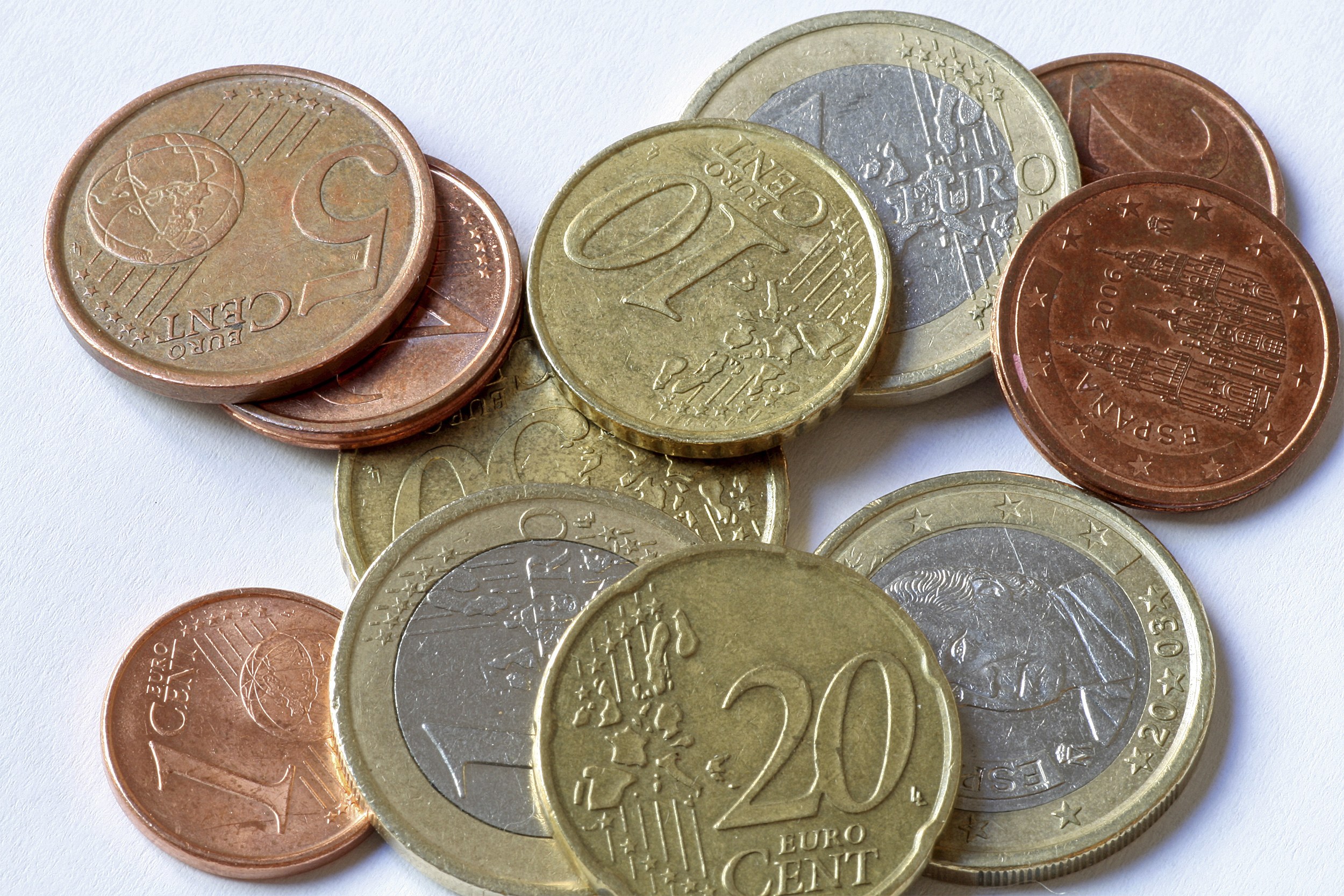 Euro coins on white surface