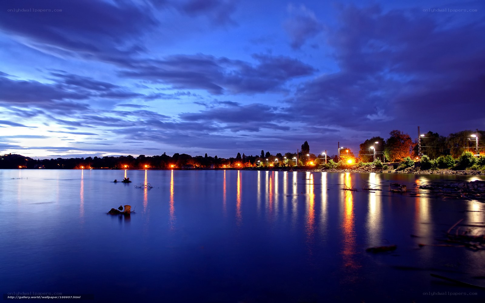 Evening lake with city lights