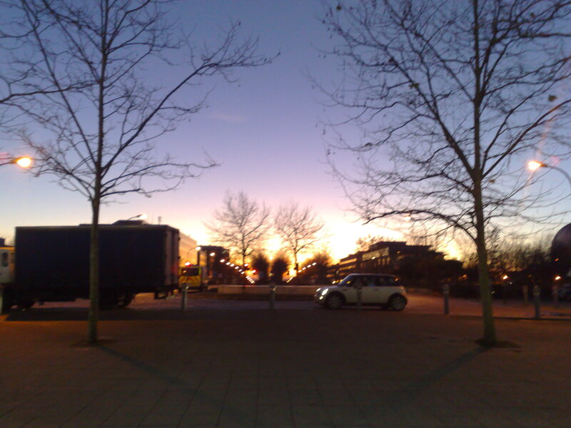 Evening street scene with cars