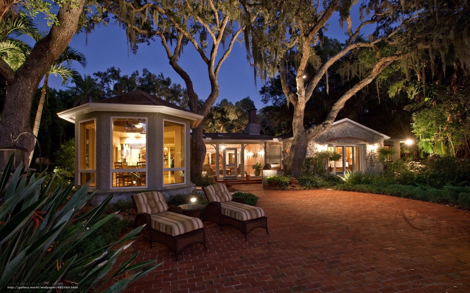 Evening view of a home with gazebo