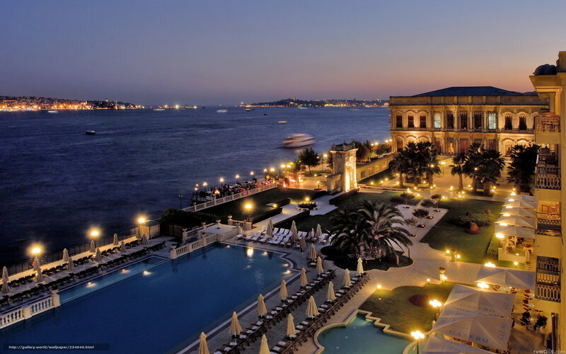 Evening view of luxury hotel by the water