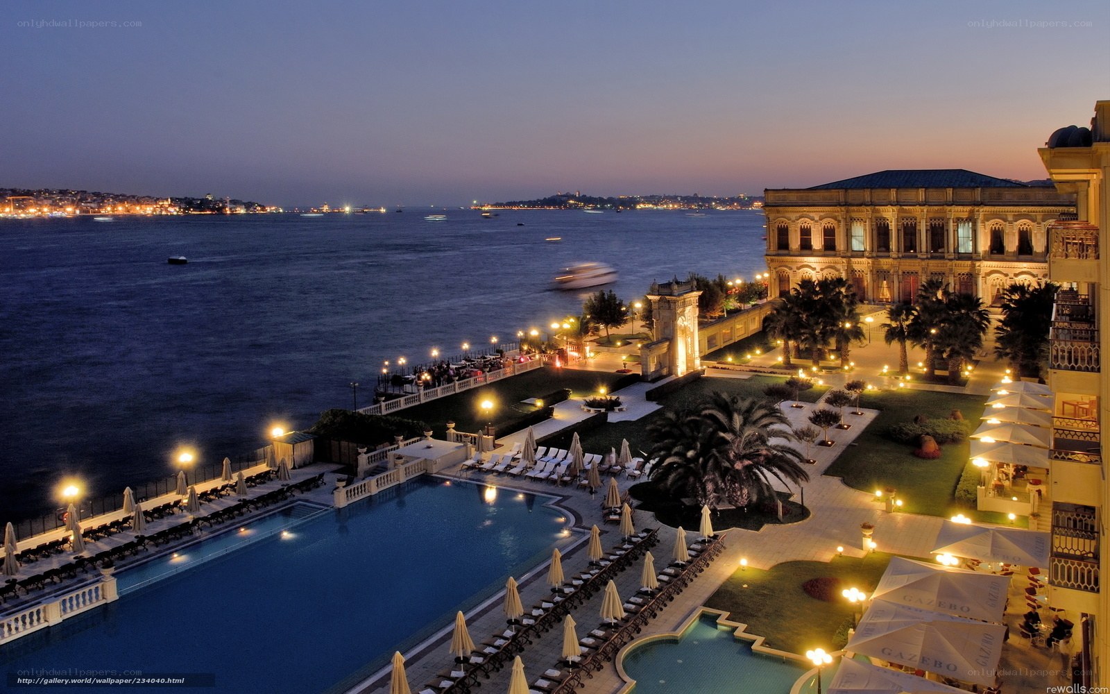 Evening view of luxury hotel by the water