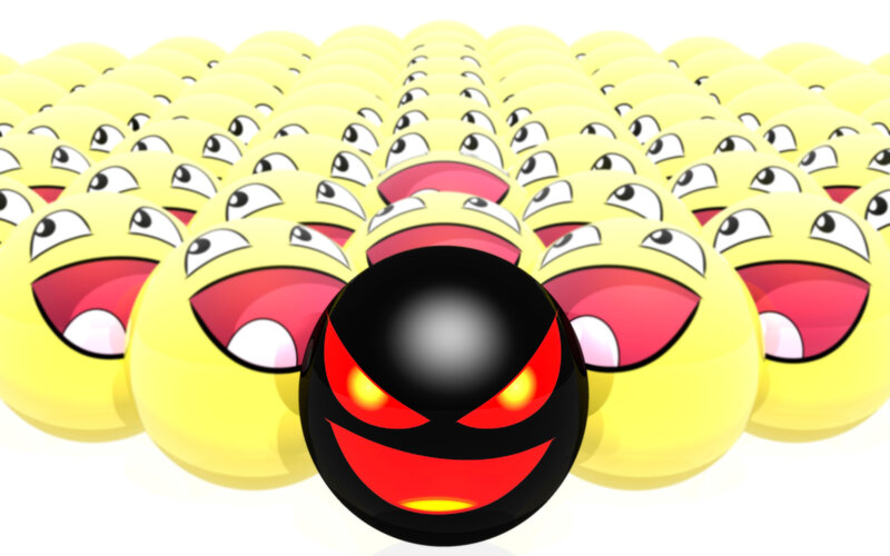 Evil emoji among laughing emojis