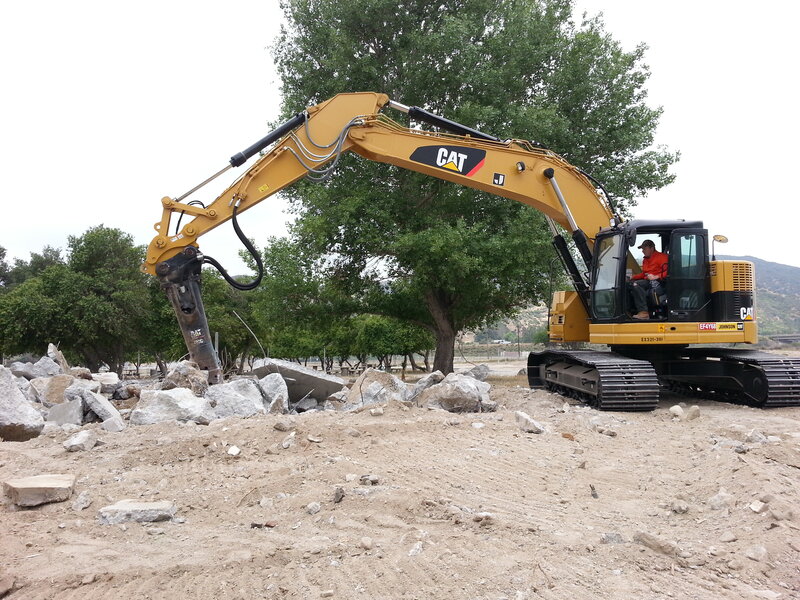 Excavator Breaking Concrete