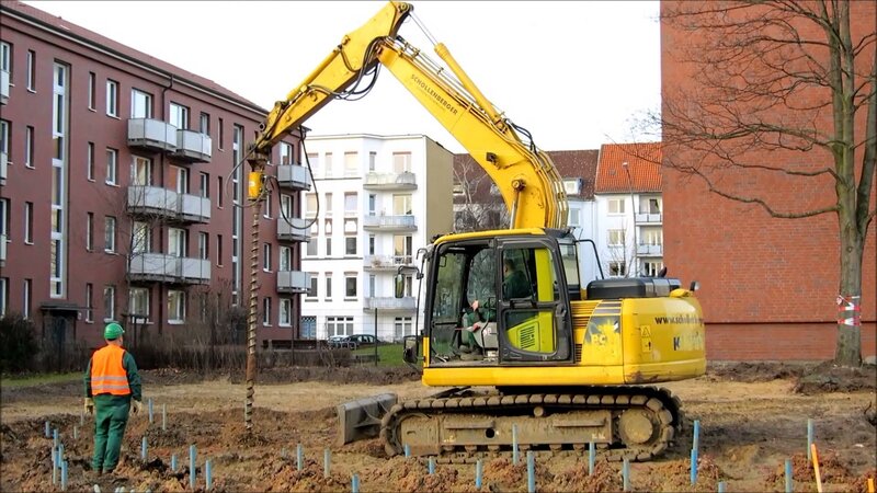 Excavator Drilling Soil