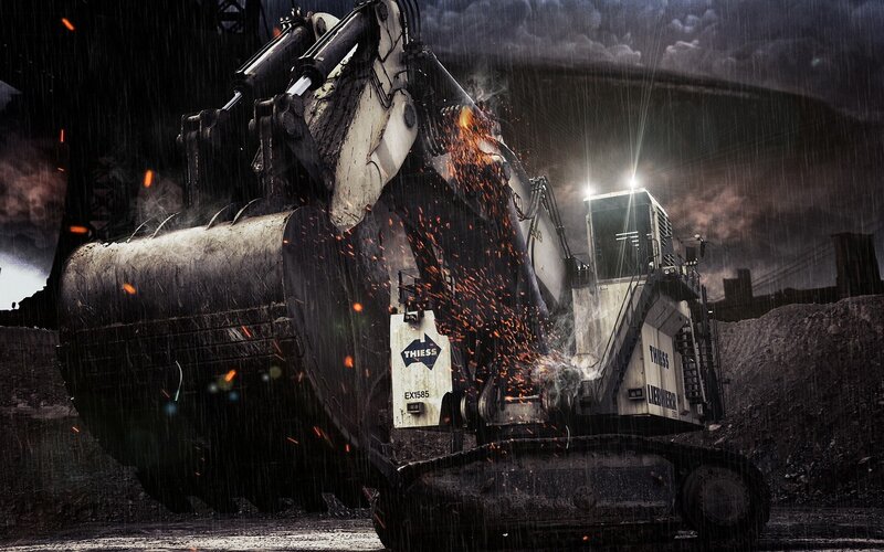 Excavator in rain with sparks