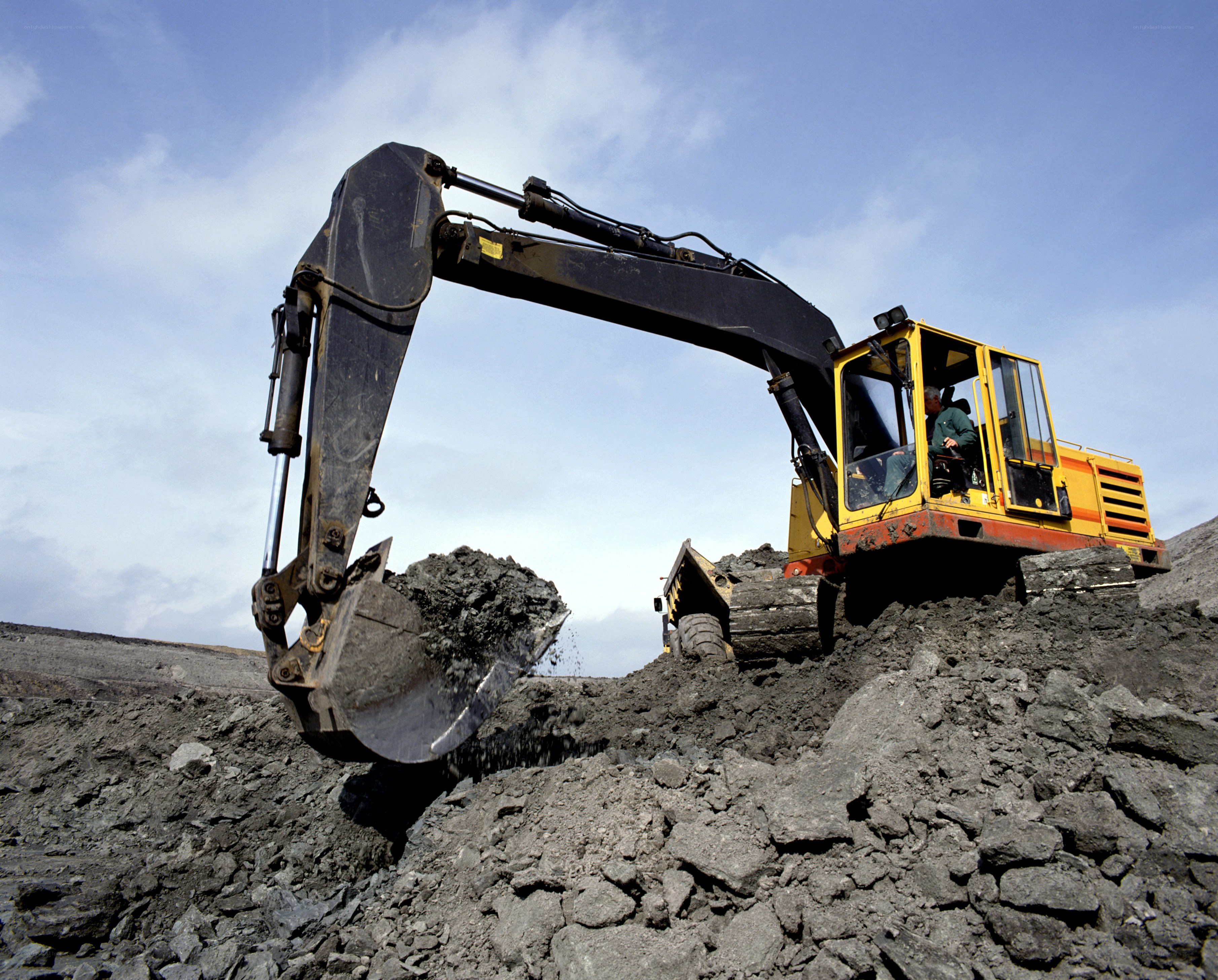 Excavator loading dirt