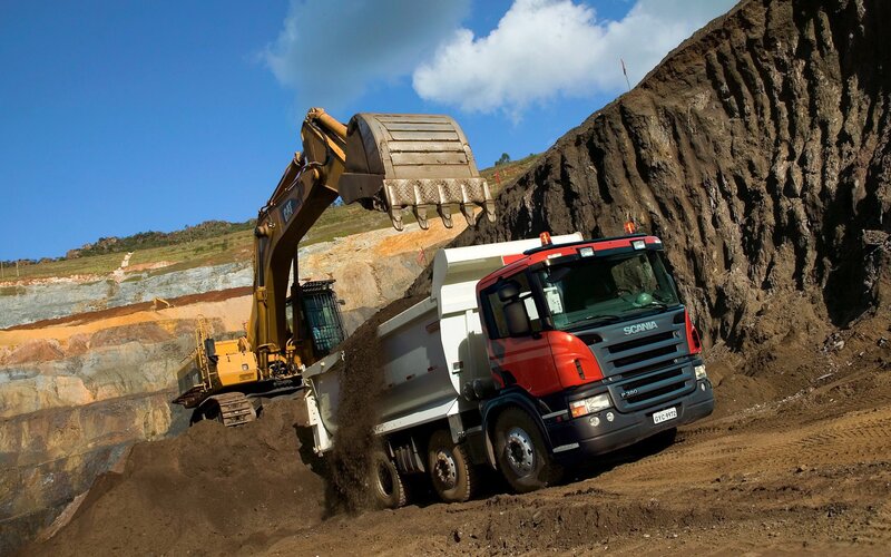 Excavator loading dump truck