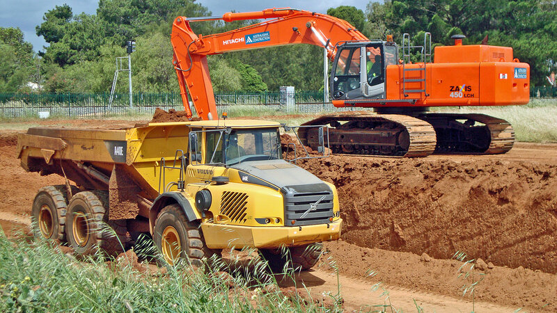 Excavator Loading Dump Truck — Orange