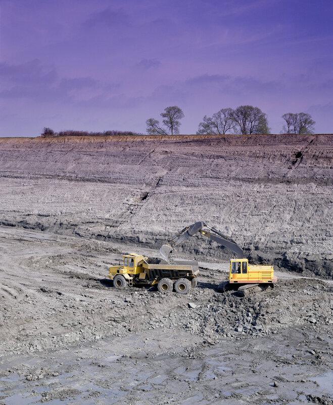 Excavator loading dump truck
