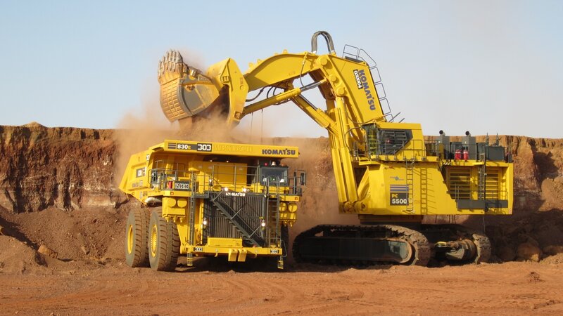 Excavator Loading Truck — Yellow, Industrial, Afternoon